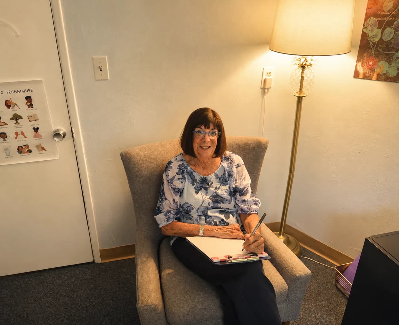 Peggy Cohen, LCSW, working with a client notepad in her San Diego office